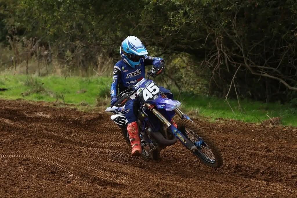 Harley Pastoor racing his number 45 motocross bike through a corner
