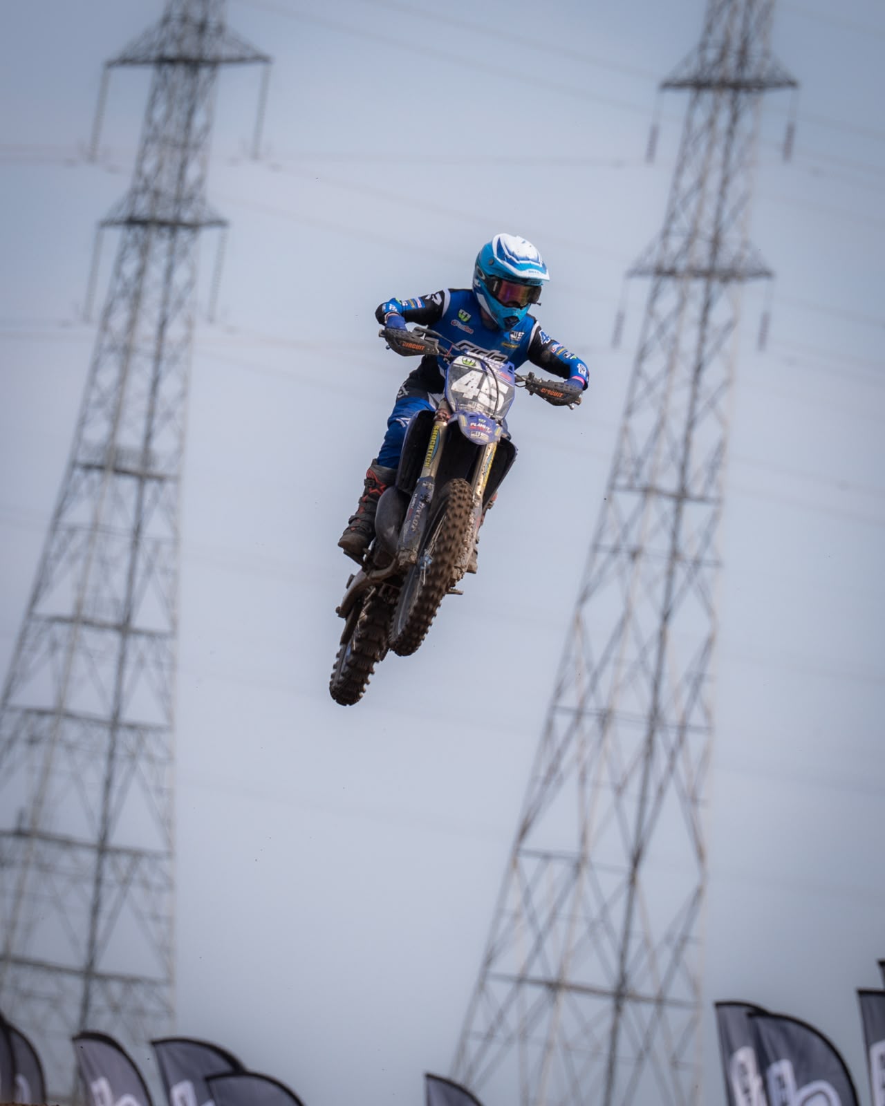 Harley clearing a dirt jump